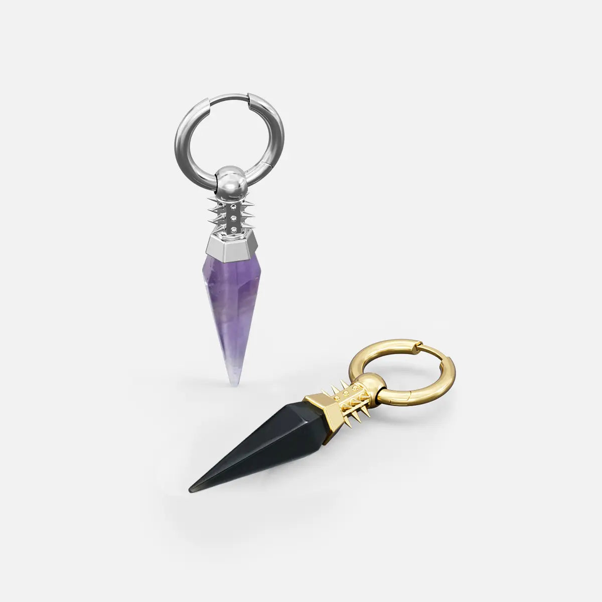 Silver and gold Rivet Prism Earrings shown together, featuring faceted crystal spikes, studded cylindrical collars, and polished hoop settings.
