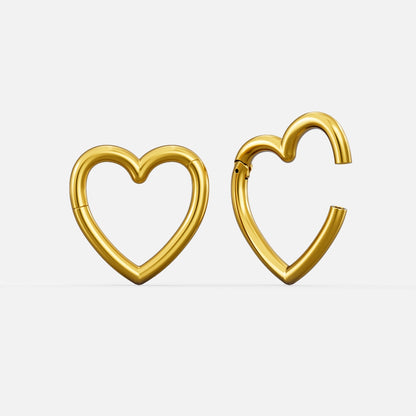 Gold-tone heart-shaped hinged ear weights, one closed and one open showing the clasp