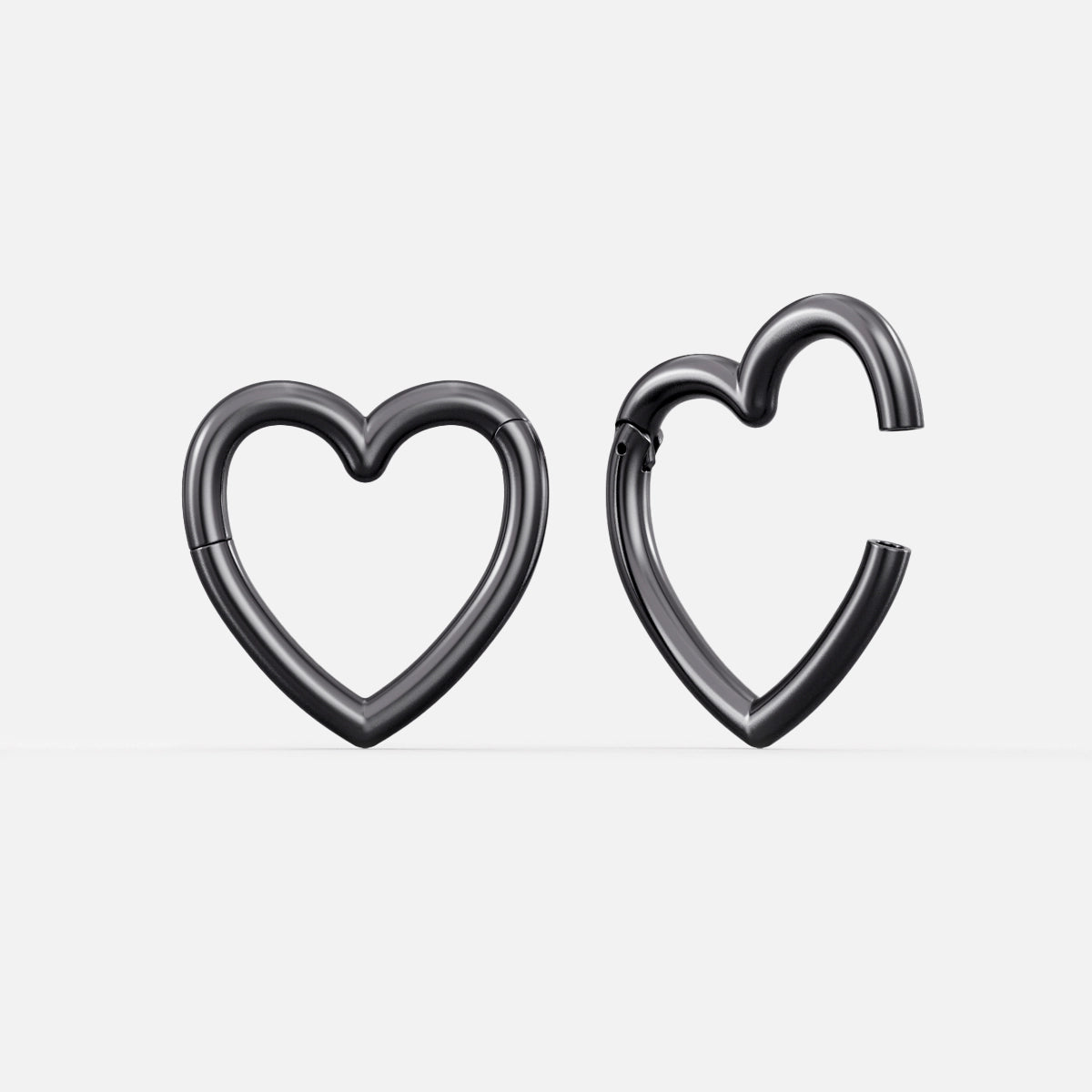 Pair of black Romantic Heart ear weights with open heart shapes
