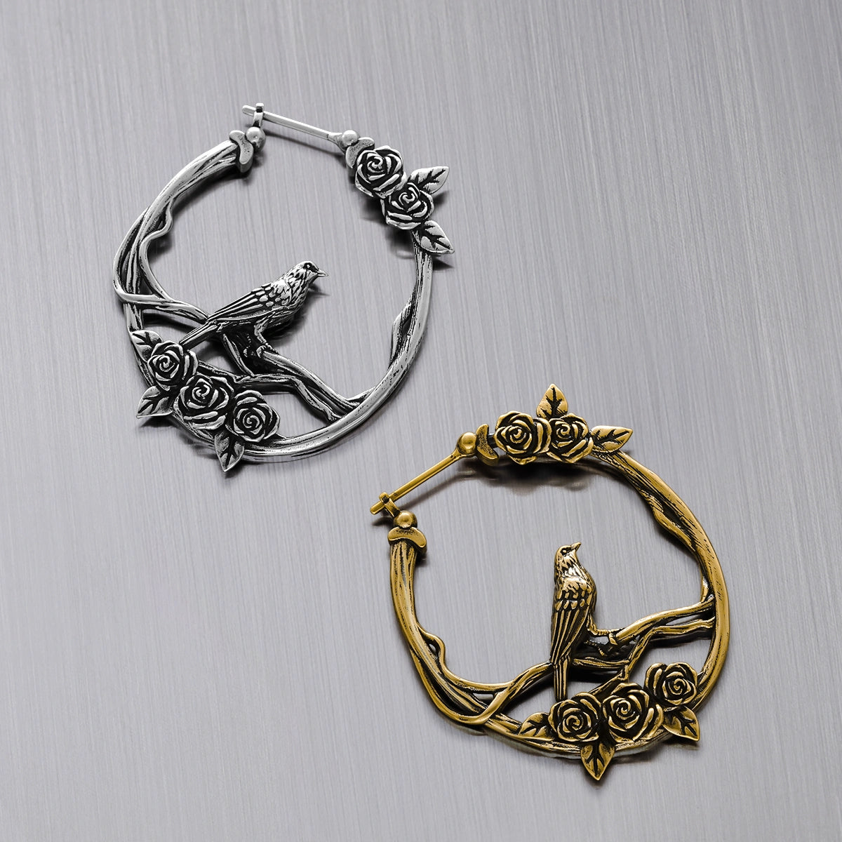 Silver and gold Rosebird hoop earrings shown together
