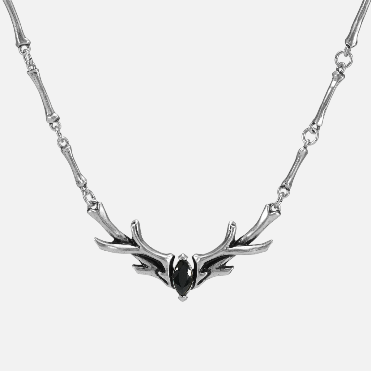 Silver Sacred Antler Collar Necklace with black obsidian stone, antler-shaped centerpiece, and bone-inspired chain details on a clean background.