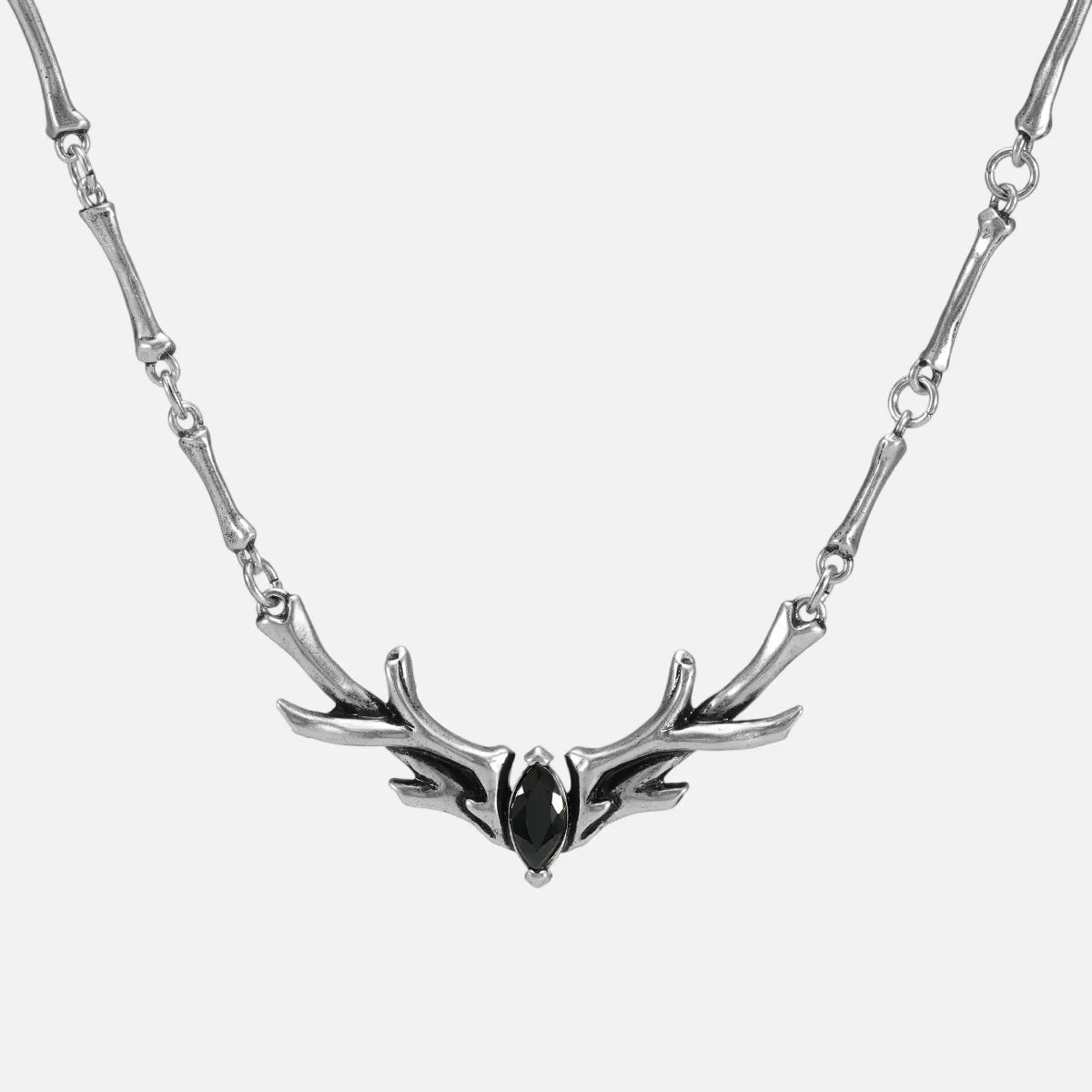 Silver Sacred Antler Collar Necklace with black obsidian stone, antler-shaped centerpiece, and bone-inspired chain details on a clean background.