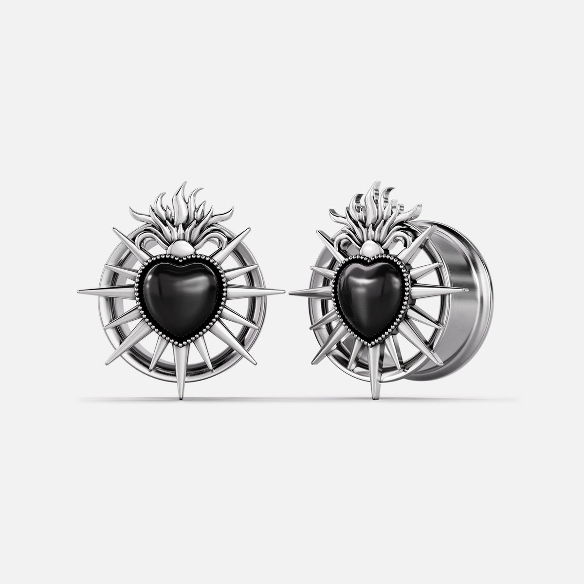 Silver-tone Sacred Flame Heart tunnels with black heart centers and radiating flame details
