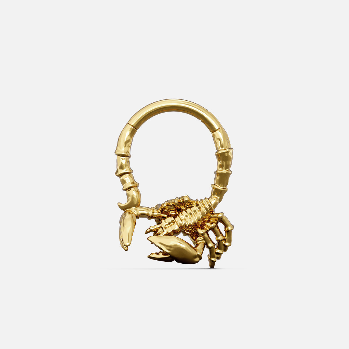Gold-tone Scorpion Empowerment Clicker with a sculpted scorpion body, pincers, and curved tail accents.