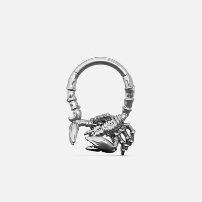 Silver-tone Scorpion Empowerment Clicker with a sculpted scorpion motif, raised armor-like texture, and curved tail detail.