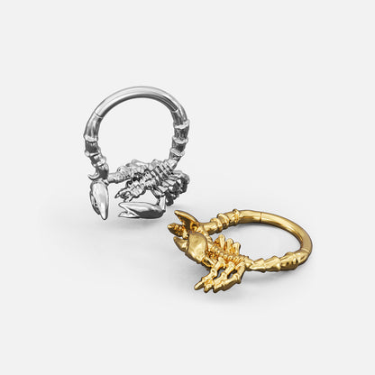 Silver- and gold-tone Scorpion Empowerment Clickers shown from multiple angles to display the ring profile and scorpion motif.