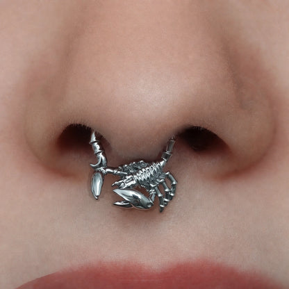 Silver-tone Scorpion Empowerment Clicker worn as a septum ring, featuring a detailed scorpion design.