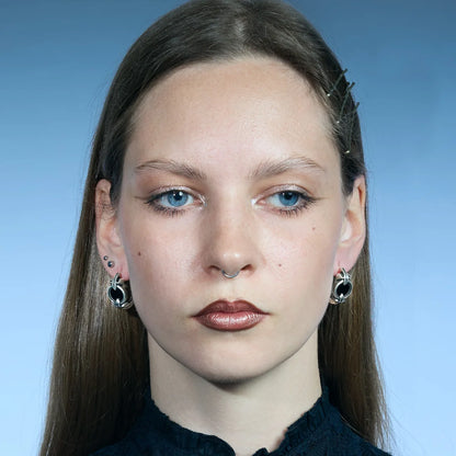 Front portrait showing a pair of antiqued silver-tone Scrying Mirror Hoop Earrings with black obsidian inlays.