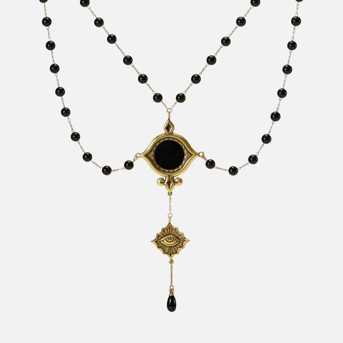 Gold-tone Scrying Mirror Necklace displayed from the front with doubled black bead chains, an oval black obsidian centerpiece, and a teardrop accent.