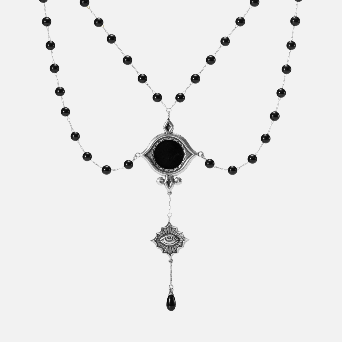 Antiqued silver-tone Scrying Mirror Necklace with doubled black bead chains, an oval black obsidian centerpiece, an eye charm, and a teardrop accent.