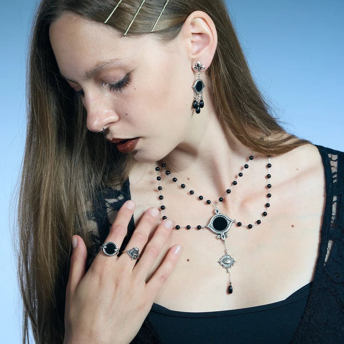 Antiqued silver-tone Scrying Mirror Necklace worn in a downward-looking portrait, highlighting the layered bead chains and vertical drop.