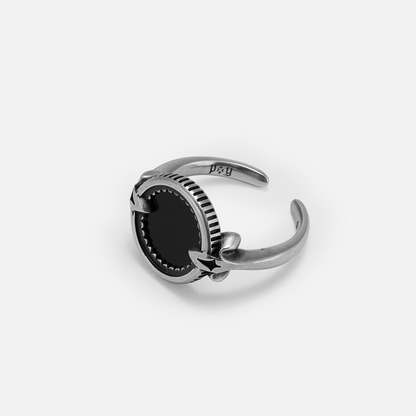 Side view of the antiqued silver Scrying Mirror Ring showing the raised black obsidian setting and adjustable open band.