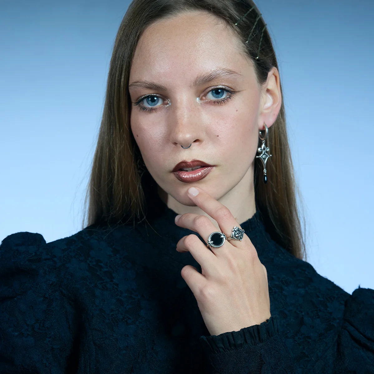 Front portrait showing an antiqued silver Scrying Mirror Ring worn near the face with a round black obsidian centerpiece.
