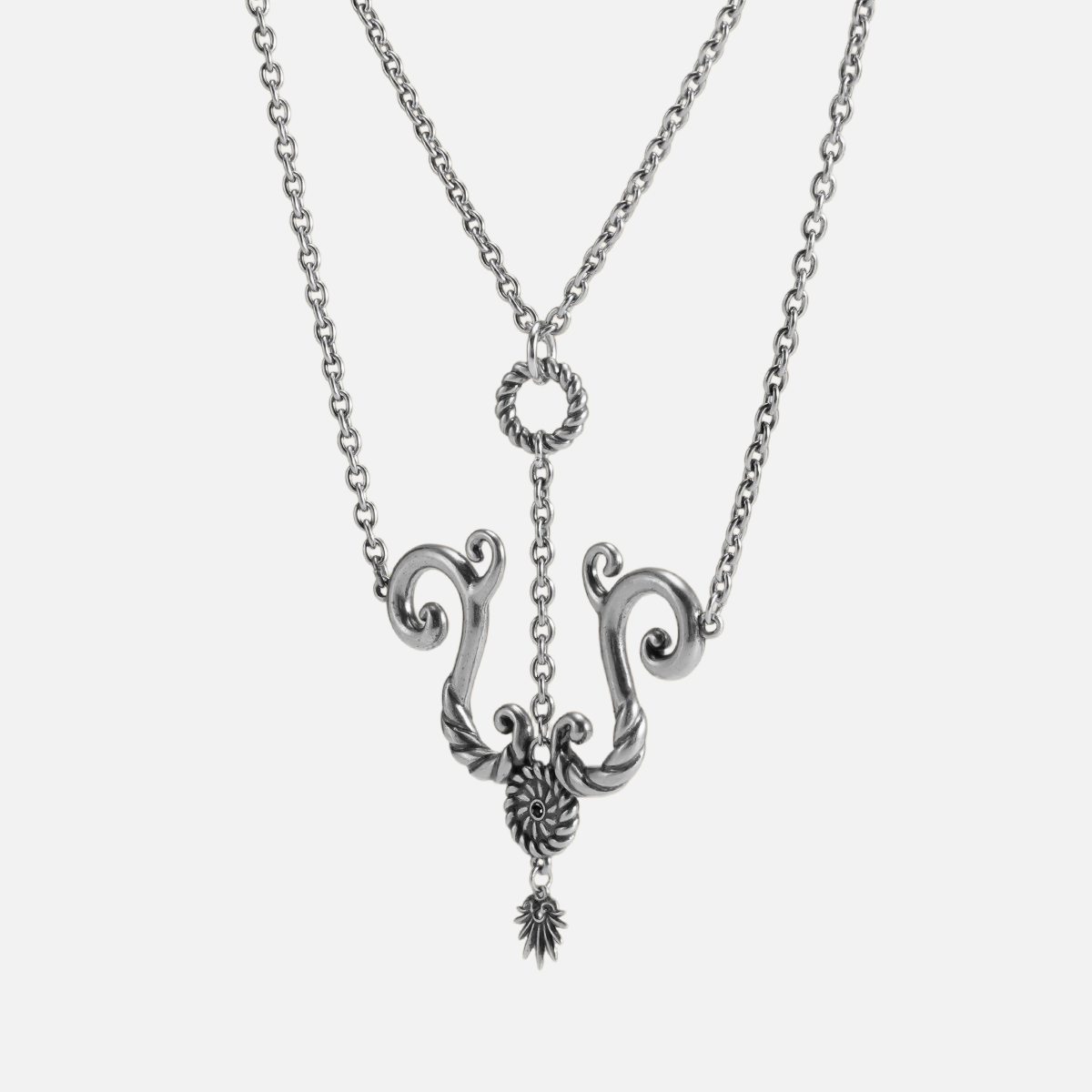 Sculptural spiral tide knot pendant with stainless steel chain in polished silver finish