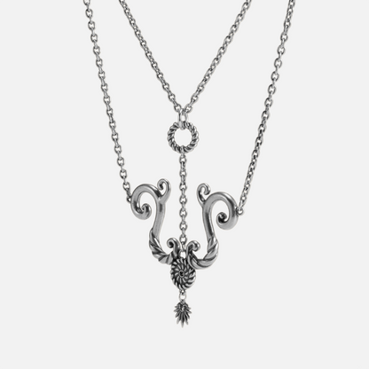 Sculptural spiral tide knot pendant with stainless steel chain in polished silver finish