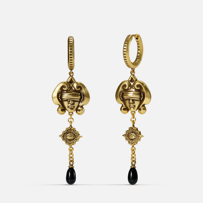 Gold-tone Second Sight Drop Earrings shown from front and side views with blindfolded face motifs, radiant eye medallions, and black teardrops.