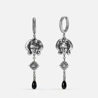 Antiqued silver-tone Second Sight Drop Earrings shown from front and side views with blindfolded face motifs, radiant eye medallions, and black teardrop accents.