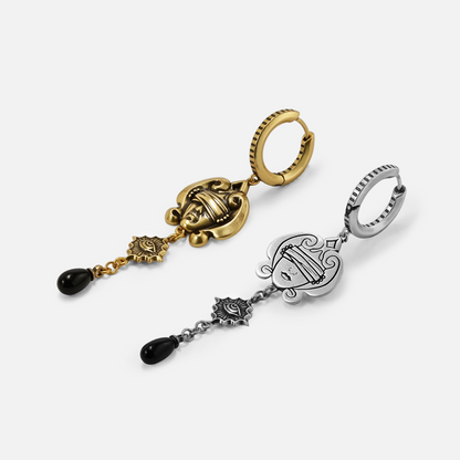 Antiqued silver- and gold-tone Second Sight Drop Earrings displayed from angled views to show their layered sections and black drops.