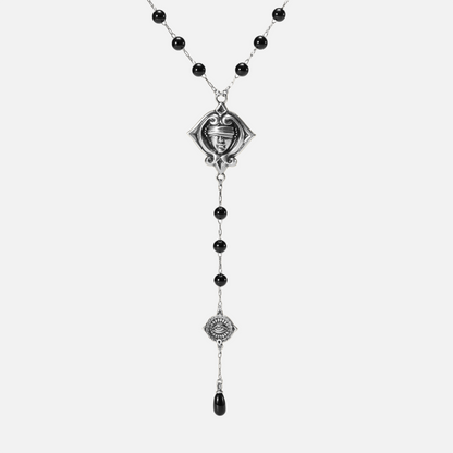 Antiqued silver-tone Second Sight Lariat Necklace with black beads, a blindfolded face motif, an eye medallion, and a black teardrop.