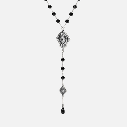 Full-length front view of the antiqued silver-tone Second Sight Lariat Necklace with black beads and a long symbolic drop.