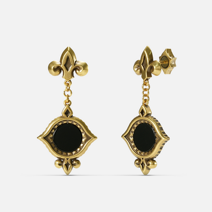 Gold-tone Silent Lens Drop Earrings shown from front and side views with round black obsidian centers and pointed eye-shaped frames.