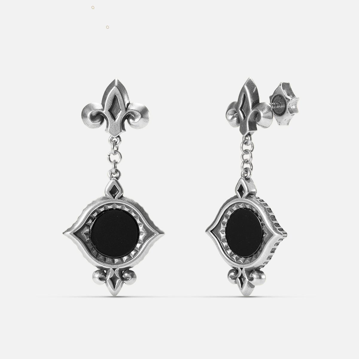 Antiqued silver-tone Silent Lens Drop Earrings shown from front and side views with round black obsidian centers and pointed eye-shaped frames.