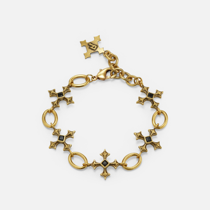 Silent Litany Bracelet in antiqued 18K gold with gothic cross-inspired links and black obsidian, shown in a full circle on wh