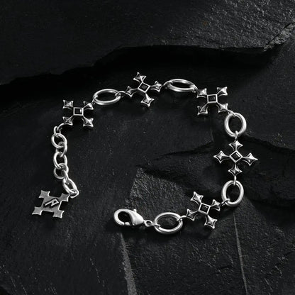 Silver Silent Litany Bracelet arranged in a full circle on black textured fabric.