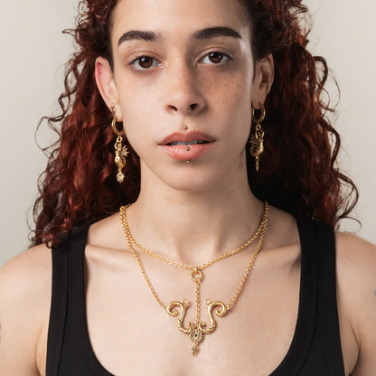Siren jewelry aesthetic mythic tide knot necklace in gold showcased on model