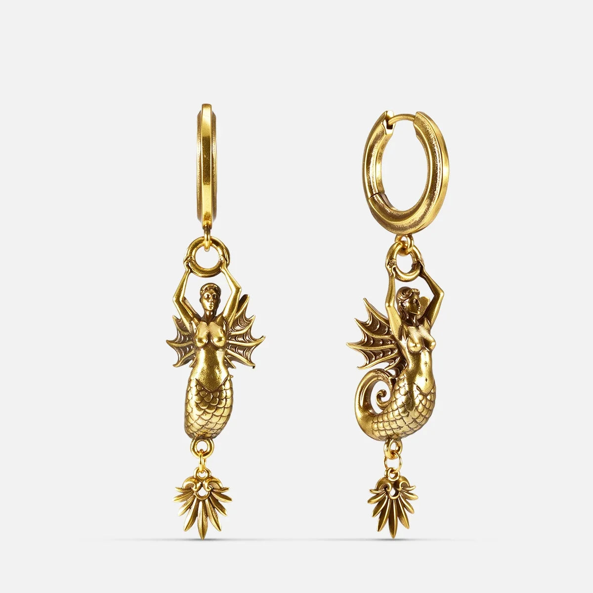 Gold Siren's Dirge Earrings with sculpted siren figure, scaled tail, sharp fins, dangling charm, and hoop design on a clean background.