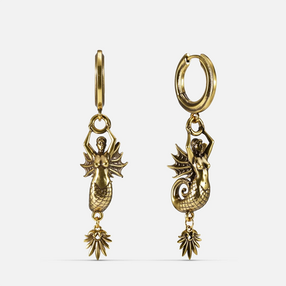 Gold Siren's Dirge Earrings with sculpted siren figure, scaled tail, sharp fins, dangling charm, and hoop design on a clean background.