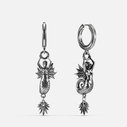 Silver Siren's Dirge Earrings with sculpted siren figure, scaled tail, sharp fins, dangling charm, and hoop design on a clean background.