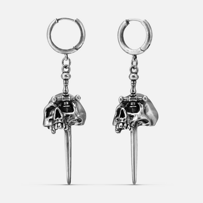 Silver-tone skull and dagger drop earrings with huggie hoops, front view pair