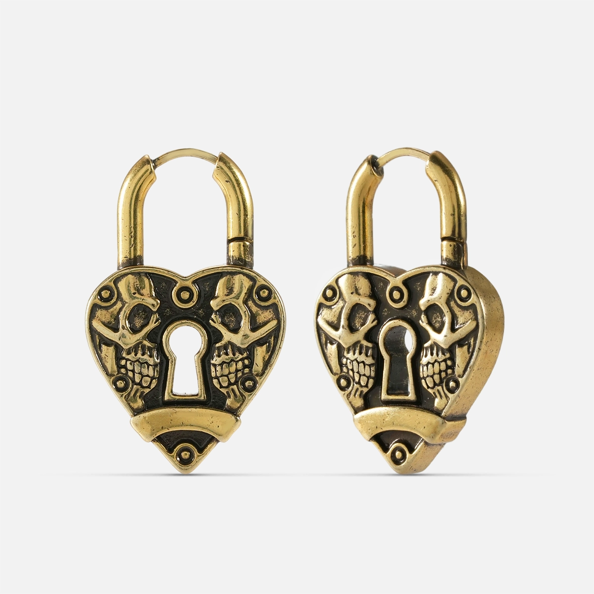 Pair of gold-tone heart lock hoop earrings with skull detailing and keyhole design, front and side view