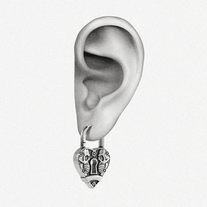 Silver Skull Heartlock hoop earring shown on an ear illustration