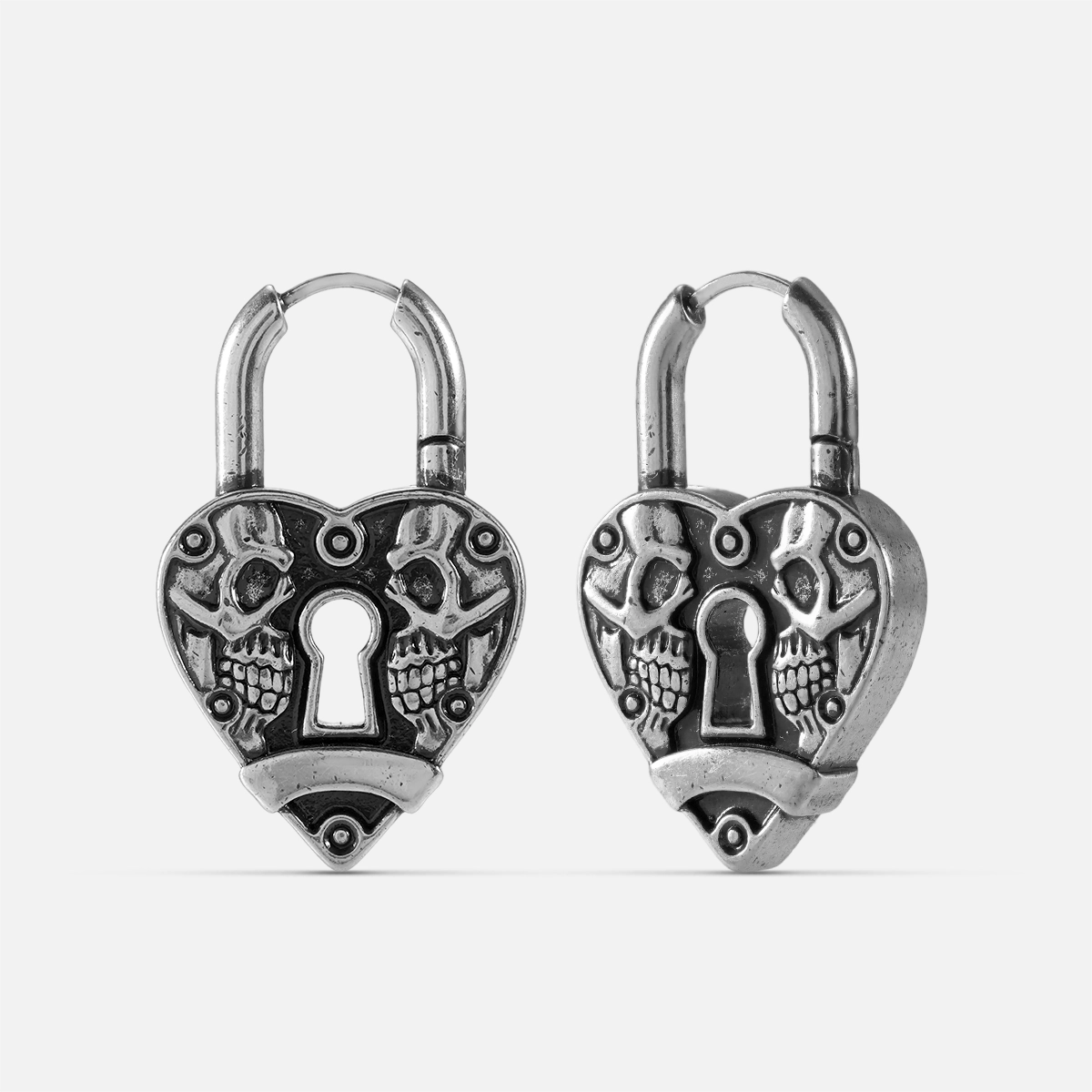 Pair of silver-tone heart lock hoop earrings with skull detailing and keyhole design, front and side view