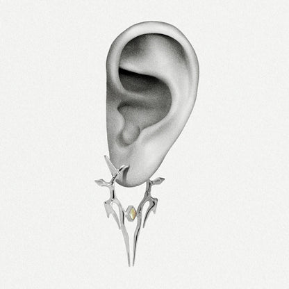 Silver Solar Guardian earring shown on an ear illustration