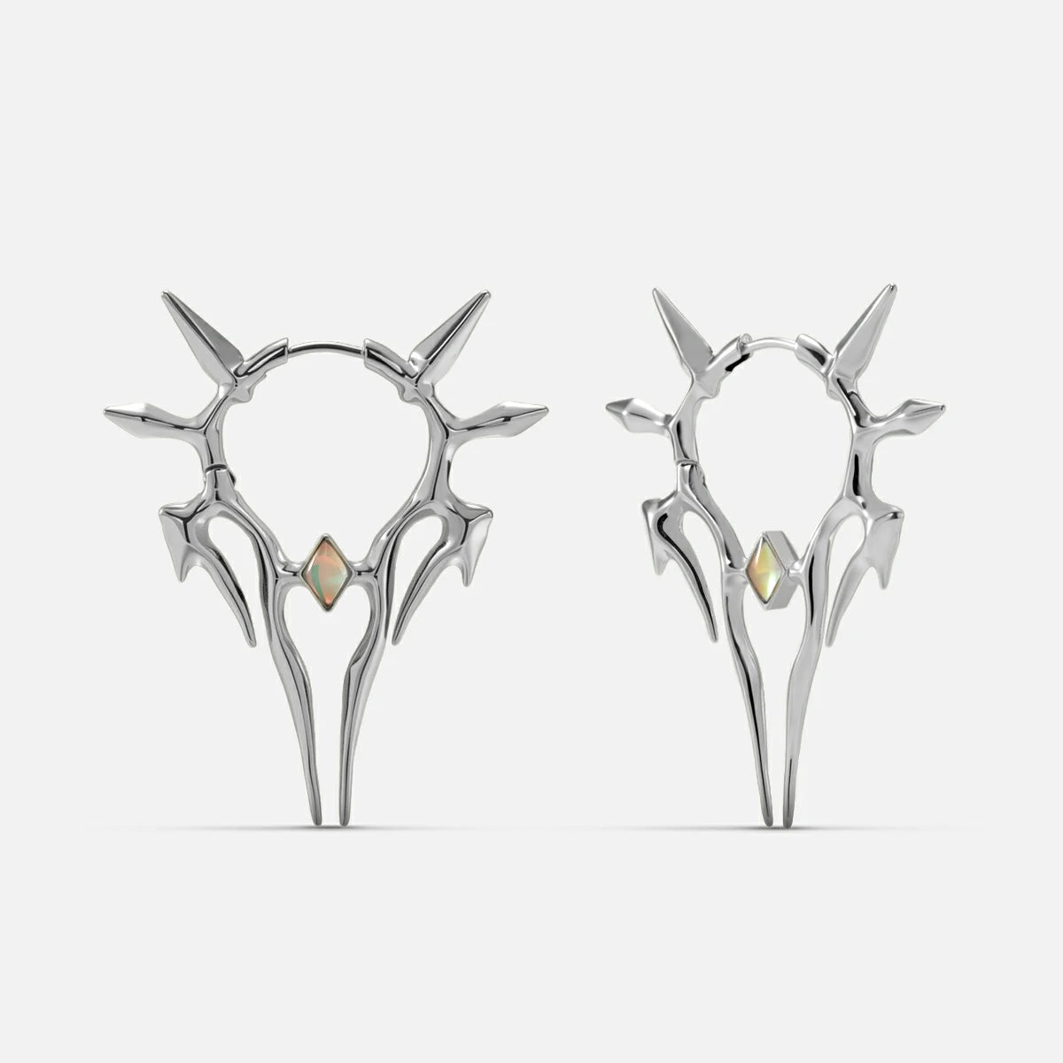 Silver-tone Solar Guardian earrings with branching spiked halos and iridescent center stones