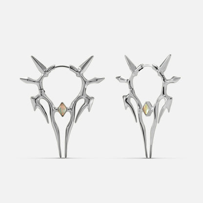 Silver-tone Solar Guardian earrings with branching spiked halos and iridescent center stones