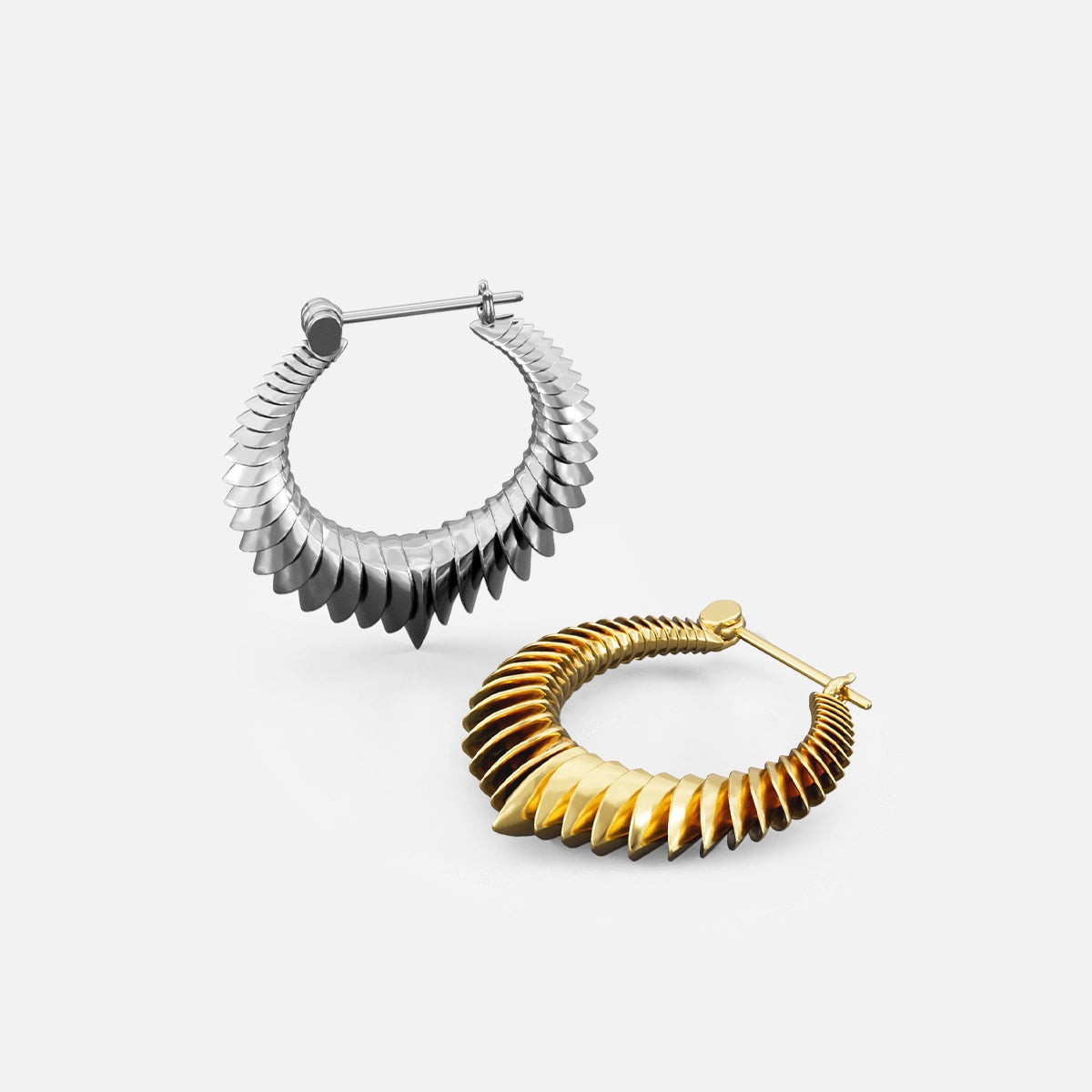 Two spine hoop earrings shown together, one in silver-tone and one in gold-tone finish