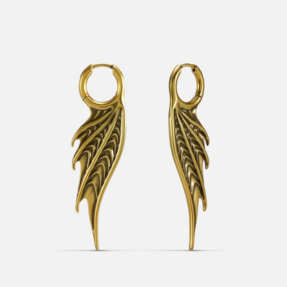 Gold Spined Wing Earrings with long ribbed wing drops, sharp fin-like ridges, and hoop design on a clean background.