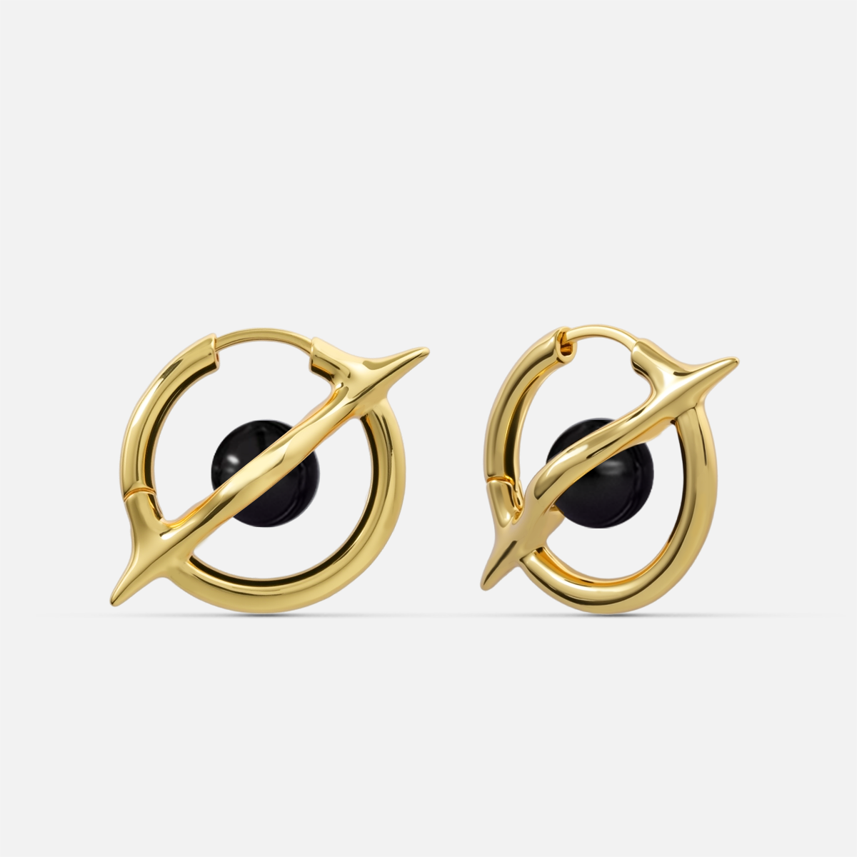Stellar Axis Earrings in gold tone with black obsidian gemstone and clean axial ring design