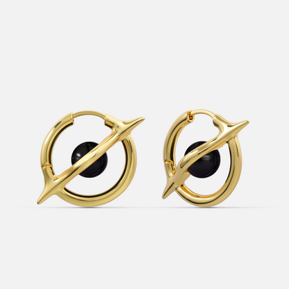 Stellar Axis Earrings in gold tone with black obsidian gemstone and clean axial ring design