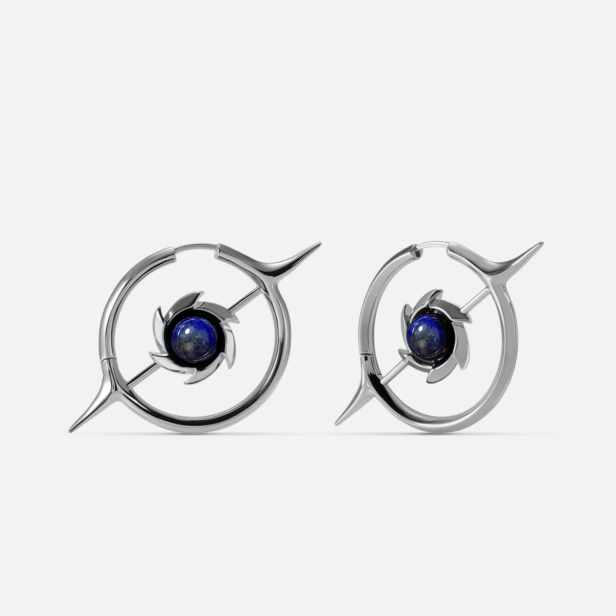 Silver-tone hoop earrings featuring a star motif and round blue stone at the center, front view pair