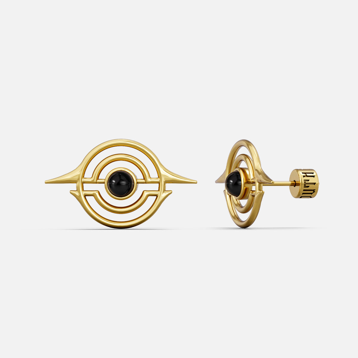Gold-tone ear studs with concentric ring design and black stone center, front and side view
