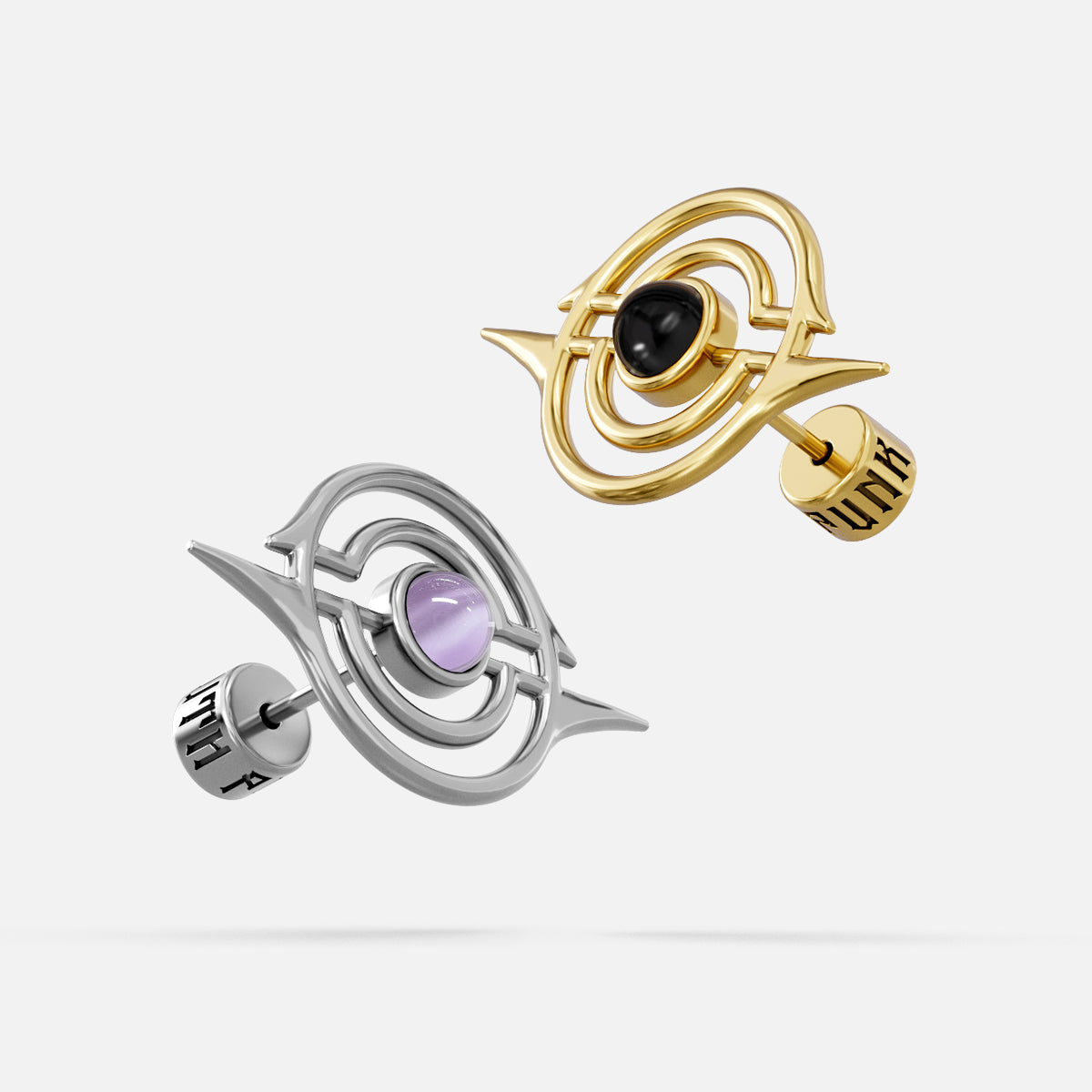 Silver and gold Stellar Grace ear studs with purple and black center accents