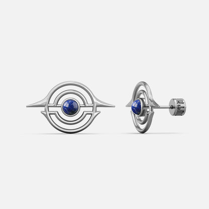 Silver-tone ear studs with concentric ring design and blue stone center, front and side view