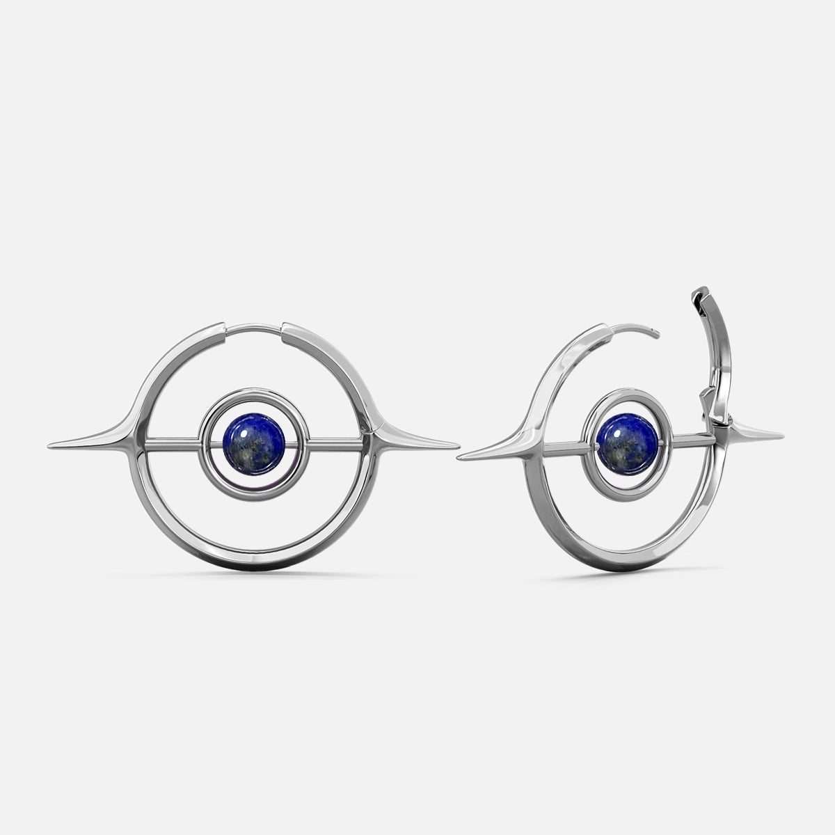 Silver-tone Stellar Grace hoop earrings with spike accents and a blue stone center, shown front and side view