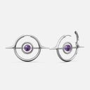 Silver-tone Stellar Grace hoop earrings with spike accents and a purple stone center, shown front and side view