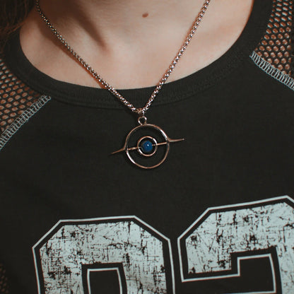 stellar grace necklace shown on a model, featuring a silver orbital pendant necklace with a lapis lazuli center stone